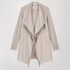 Manteau bi matière avec col drapé et frange en daim