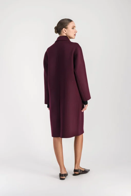 Manteau mi-long poches en fourrure muscat